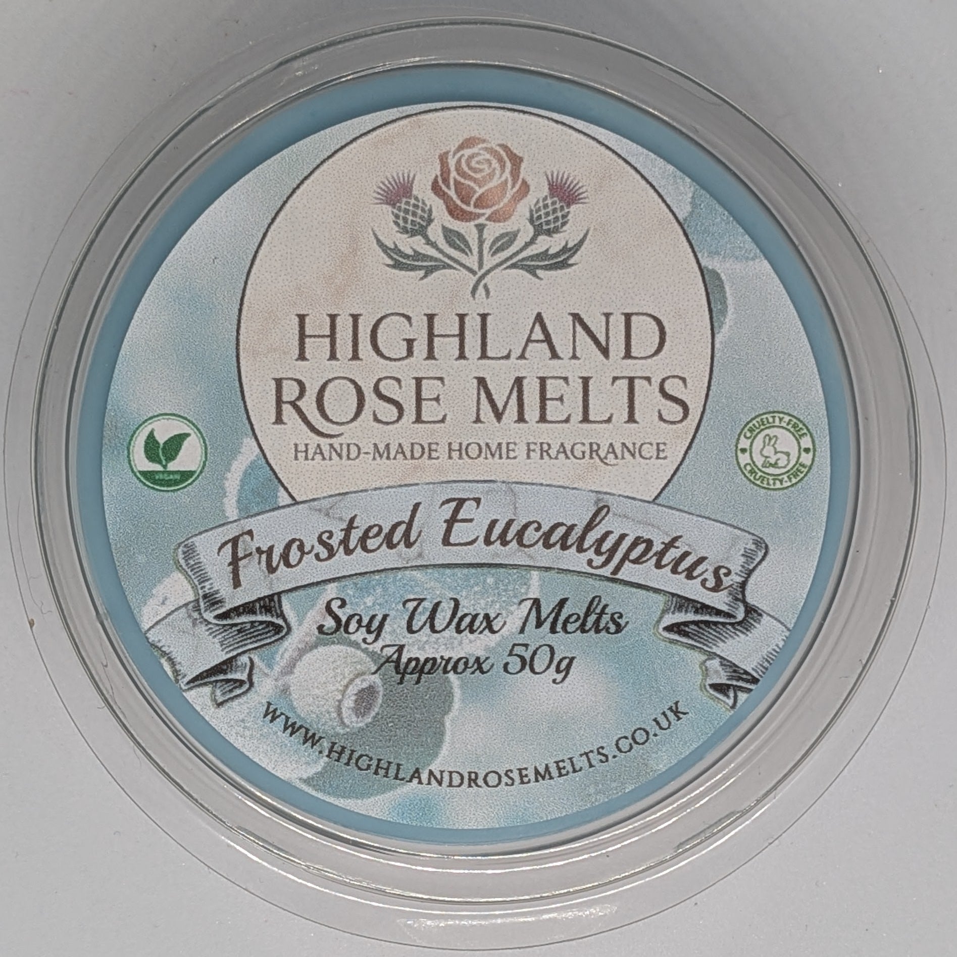 Highland Rose Melts wax melt container on a light gray background